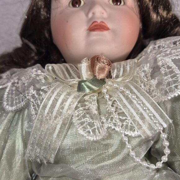 Heirloom Treasure Doll, Dark Long Curley Hair with Green Dress and Bow on Front - Picture 9 of 10